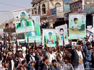 Houthi demonstrators protesting the refusal of the Saudi-led coalition to pay compensation for victims of an airstrike in Yemen
