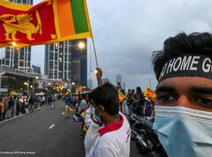 Protesters with flag in demostration against Sri Lanka goverment