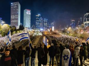 Thousands of protesters line the streets at night in Israel demonstrating against Bibi's and Yariv Levin's plans to suppress the powers of the Supreme Court