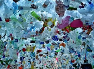 Art installation of wasted materials by Tan Zi Xi (Singapore) Thousands of disguarded plastic products hang to symbolise the problem with plastic waste