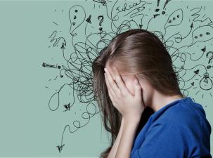 Image of a troubled young woman with a lot of troubled thoughts.