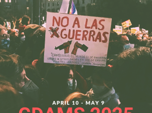 Poster for the 2025 GDAMS campaign. Protesters stand wearing PPE masks and holding signs. In the forefront of the image there is a sign which says 'No A Las Guerras'