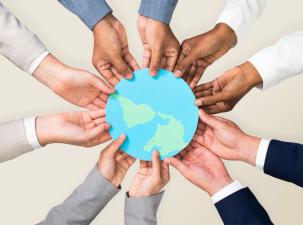 Image of a set of hands holding a globe