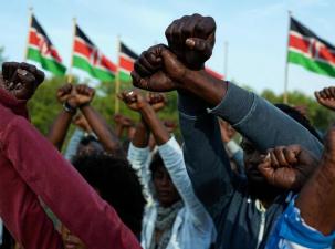 Close-up of a group of kenyan protesters with their arms folded in public demonstrations