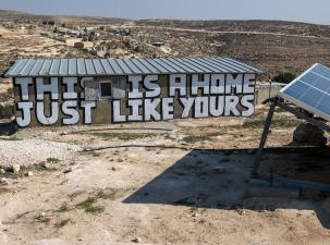 House in Khallet a-Dabe at risk of eviction by Israel. Huge letters have been painted on the side of the house which say 'This is a home just like yours'