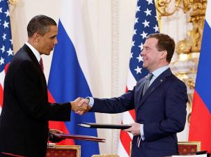 Barack Obama and Dmitry Medvedev shake hands after signing the "New START" treaty in Prague.