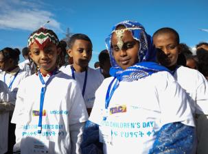 Children in Ethiopia celebrate World Children's Day & 30 years of the Convention on the Rights of the Child. They are wearing tshirts from UNICEF and traditional jewelery.
