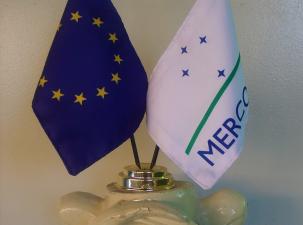 The Two flags of the European Union and the South American trade bloc stand side by side.