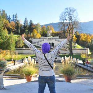 A Happy girl during her vacation time in Germany at the beautiful castle garden