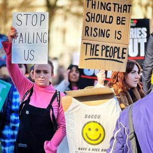 Two women protest in London about the cost of living crisis