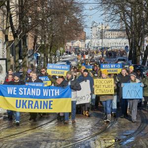 We Stand With Ukraine protest in Helsinki, anti-war protesters march in the street