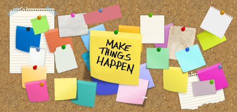 Many coloured sticky notes are pinned to a notice board with a large yellow on in the centre which says ' make things happen'