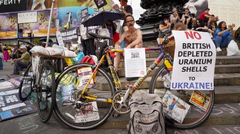 Message seen on a bicycle during a protest by Julian Assange supporters at Piccadilly Circus which reads 'No British Depleted Uranium Shells to Ukraine'.