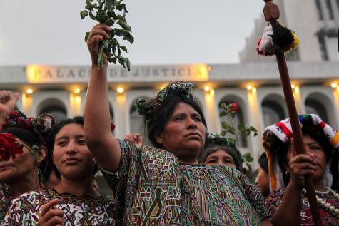 5 Guatemalan women celebrate outside the Palace of Justice after former Guatemalan dictator Rios Montt was found guilty of genocide against the indigenous Ixil people in the 1980s