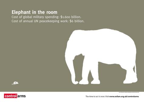 Grey poster highlighting the difference between global military spending and the UN peacekeeping budget. There is a large picture of a white elephant and the poster says 'Elephant in the room'