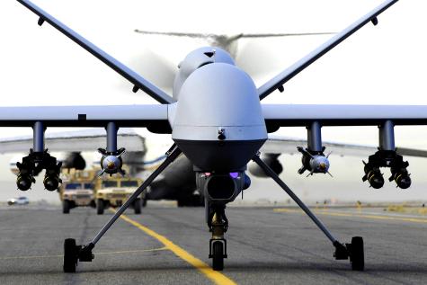 A fully armed MQ-9 Reaper unmanned aerial vehicle taxis down the runway at an air base in Afghanistan