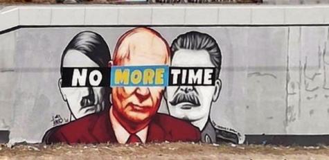 Mural in Poland of Hitler, Putin, and Stalin. The slogan 'No more time' is painted over their eyes