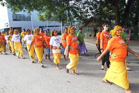 Women from Lord House Settlement community March in the opening parade for 16 Days of Activism Against Gender Based Violence.
