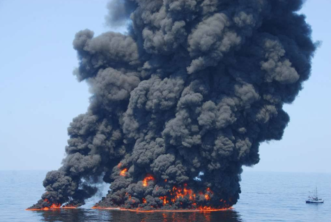 A controlled burn of oil from the Deepwater Horizon/BP oil spill sends towers of fire hundreds of feet into the air over the Gulf of Mexico 