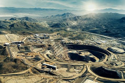 An aerial photograph of the Mountain Pass Rare Earth Mine & Processing Facility in San Bernardino County, California.