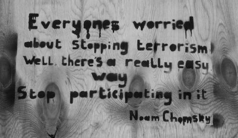 Noam Chomsky quote on terrorism, has been spray painted on to the side of a wall. 