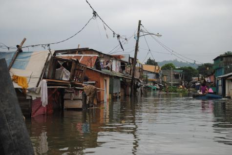 Poor suburbs along the large Laguna lake near the capital Manila have been badly flooded after torrential rains.