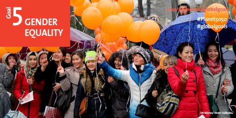 Image promoting SDG5. A group of young women standing holding orange balloons.