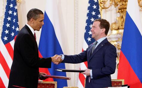 Barack Obama and Dmitry Medvedev shake hands after signing the "New START" treaty in Prague.