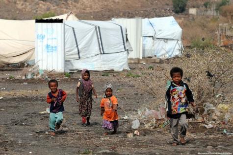 Children are seen in front of makeshift tents at Darwan refugee camp in Amran north of Sana’a, Yemen