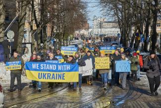 We Stand With Ukraine protest in Helsinki, anti-war protesters march in the street