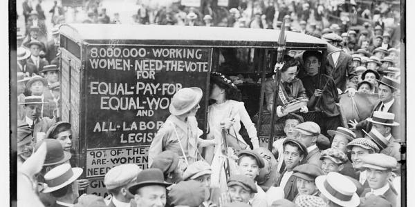 Black and white image of the Suffragettes on their way to Boston
