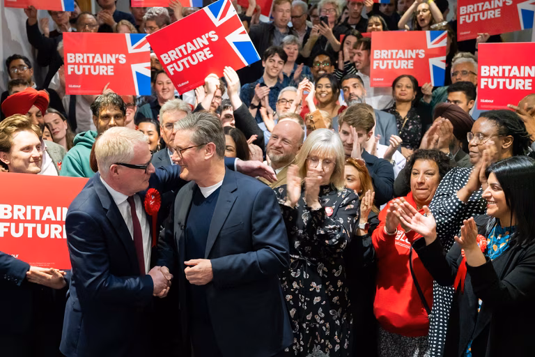 Keir Starmer, leader of the Labour Party, and Richard Parker, Labour&rsquo;s newly elected West Midlands Mayor, celebrate with activists at the ICC in Birmingham
