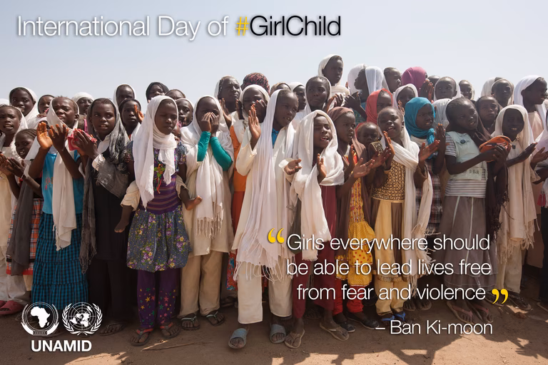 UN poster for International Day of the Girl. A group of young African girls are clapping outside. There is a quote underneath from Ban Ki-Moon which says 'Girls everywhere should be able to lead lives free from fear and violence.'
