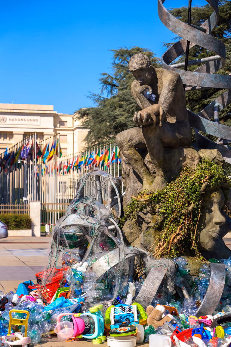 Art installation in front of the Palais des Nations in Geneva, Switzerland symbolising the burden of plastic waste.