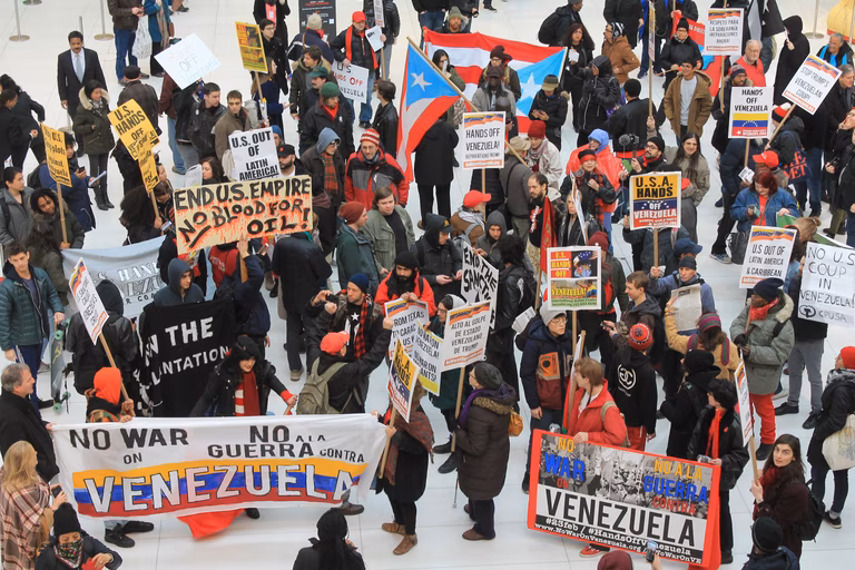 500 demonstrators rallied outside the Trump Building on Manhattan's Wall Street to protest the United States' sanctions, diplomatic maneuvers and military threats against Venezuela. 
