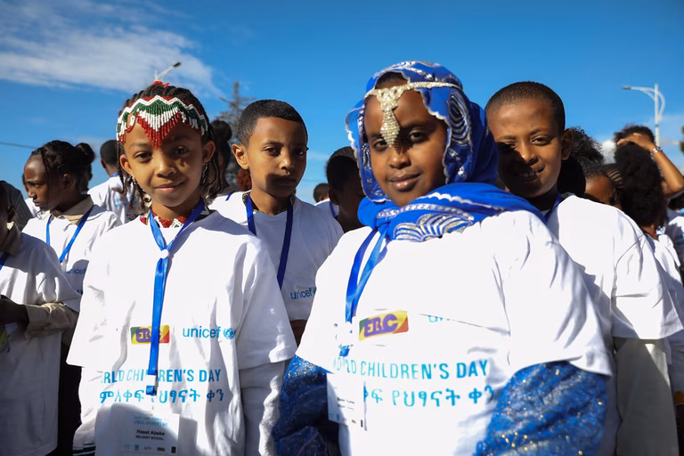Children in Ethiopia celebrate World Children's Day & 30 years of the Convention on the Rights of the Child. They are wearing tshirts from UNICEF and traditional jewelery.