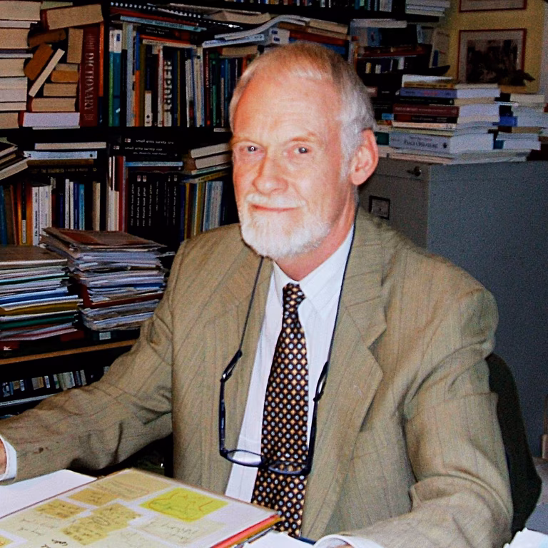 Photo of Colin Archer at his desk in the IPB office